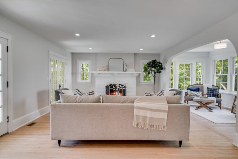 Modern living room with white brick fireplace in a Twin Cities home